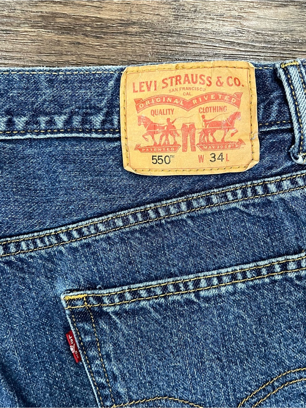Levi's Men's 550 Relaxed Jorts in Blue with Tan Patch